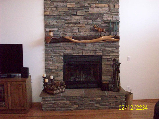 living room, custom interior, river rock, fireplace